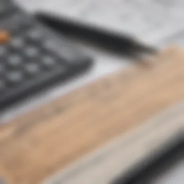 A close-up of tax forms with a calculator and a pen